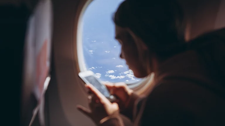 IFC-girl-holds-phone